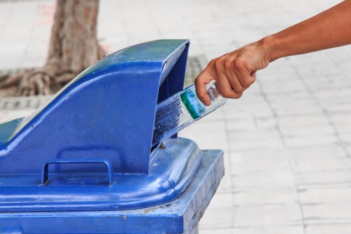 Two-person crew loading bulky waste from a terrace conversion